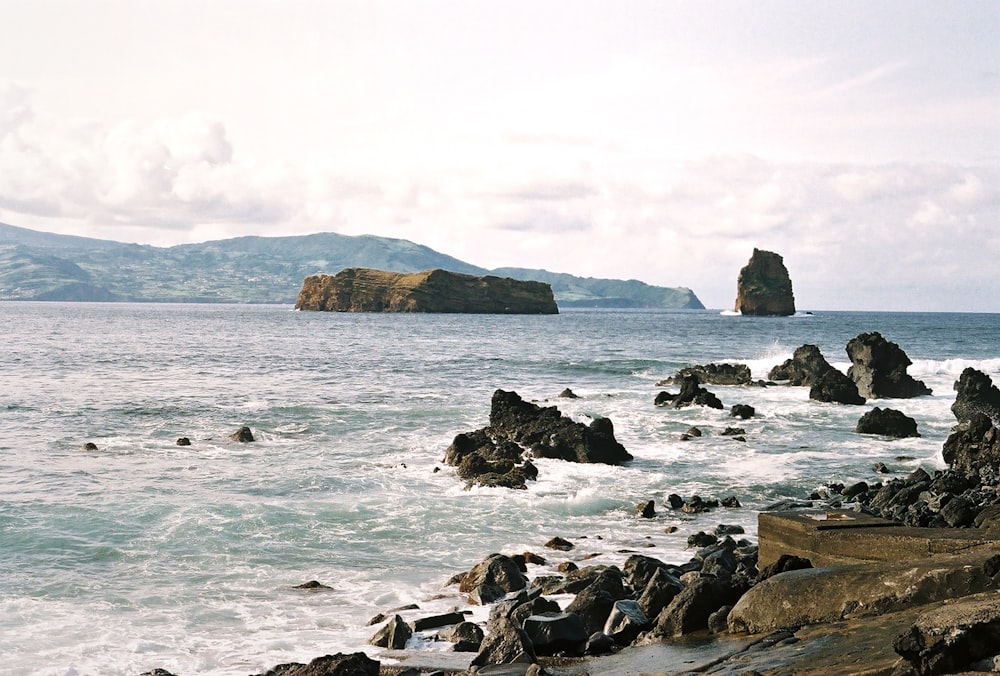 a large body of water surrounded by rocks