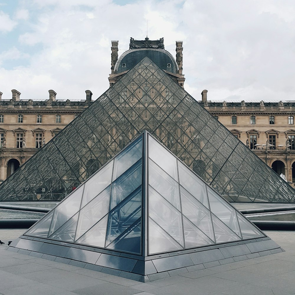 a pyramid shaped building with a sky background