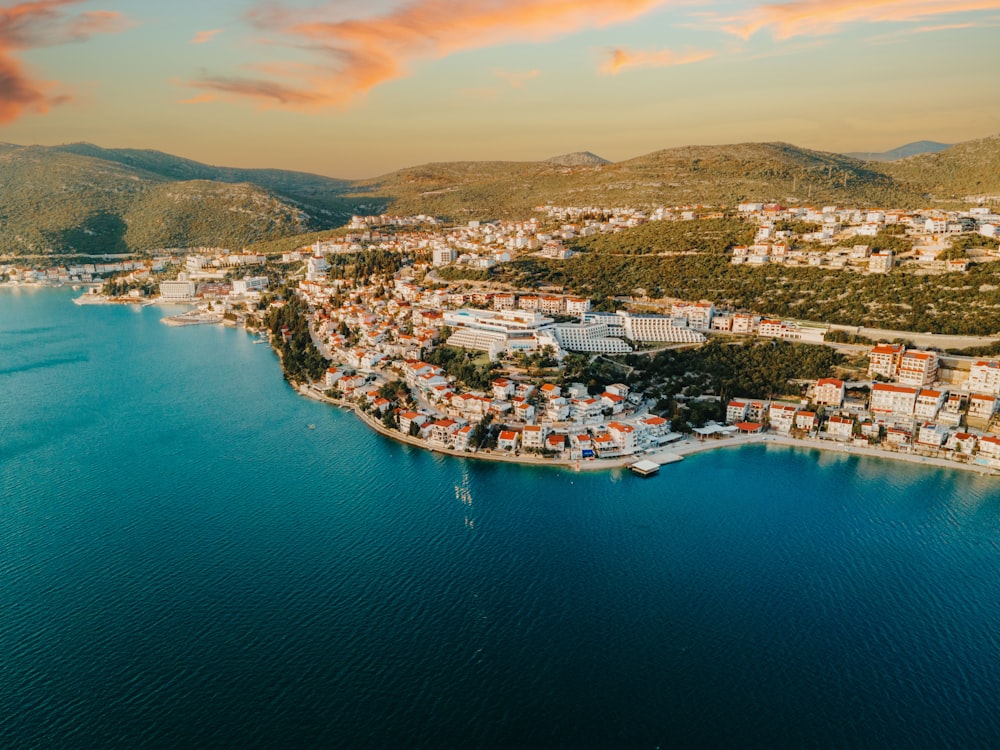 an aerial view of a city on a lake