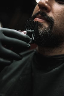 a man getting his hair cut by a barber