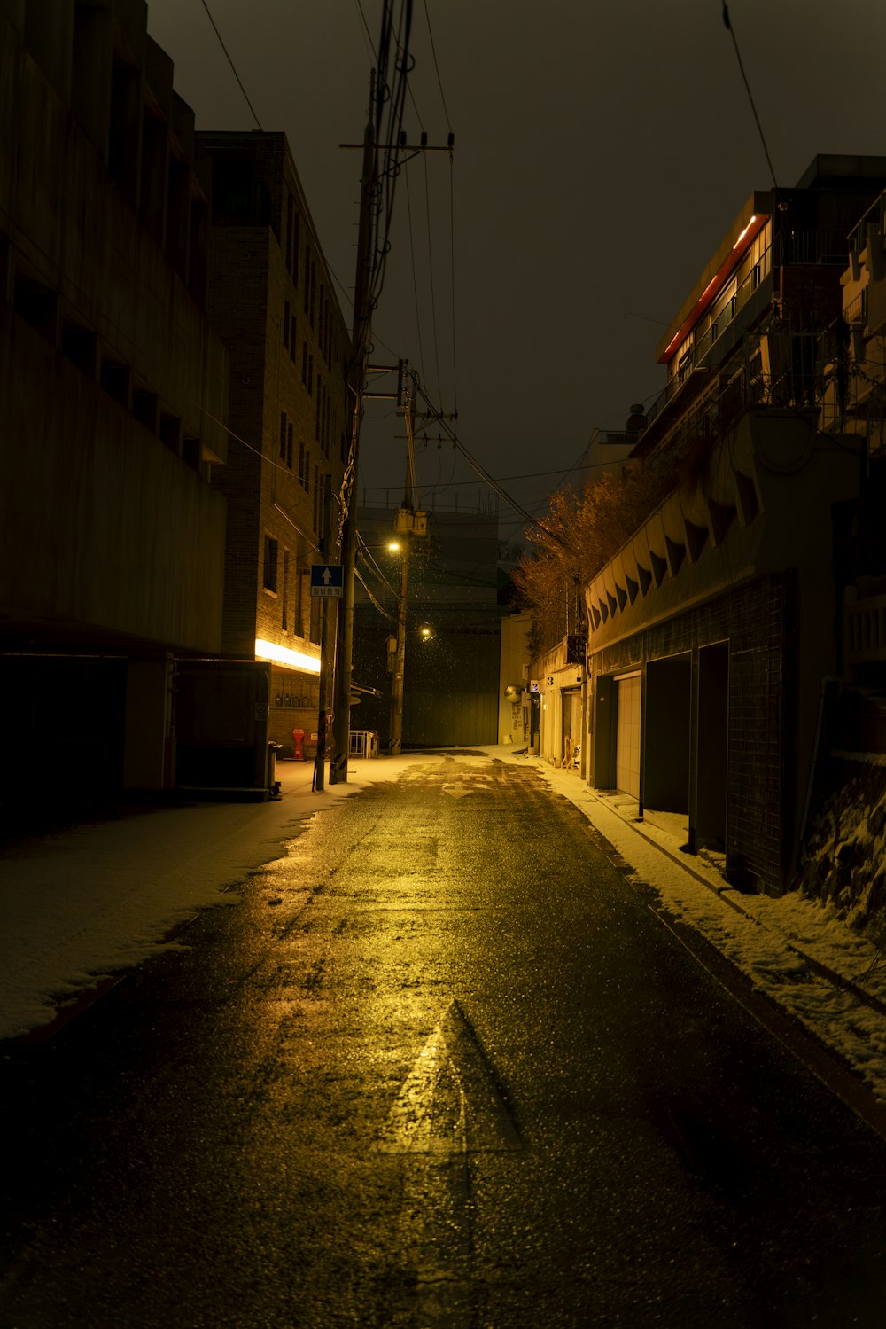 a dark street at night with no cars on it