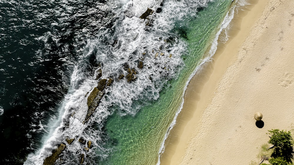 a bird's eye view of a beach and ocean