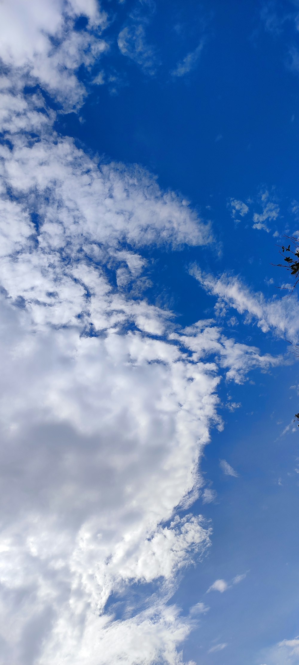 a plane flying in the sky with a lot of clouds