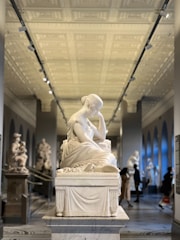 a statue of a woman in a museum