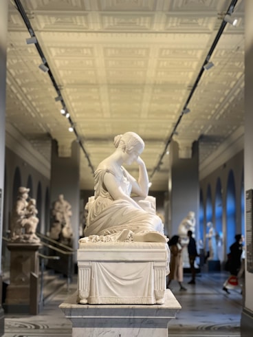 a statue of a woman in a museum