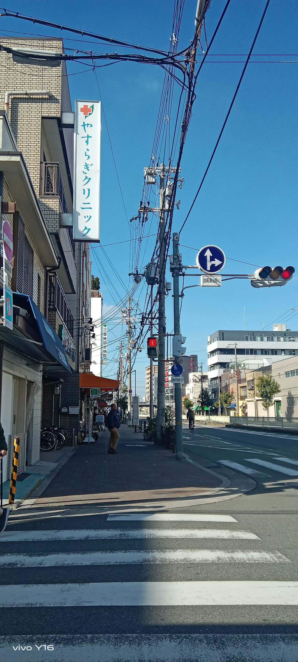 a city street with a traffic light and street signs