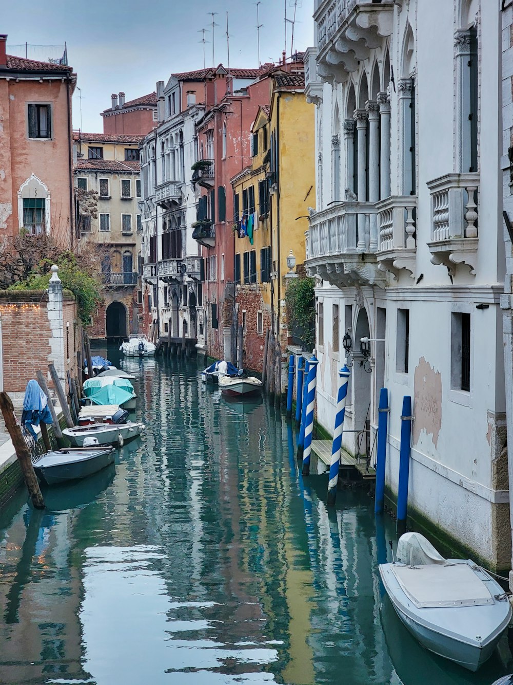 a canal with boats and buildings on both sides