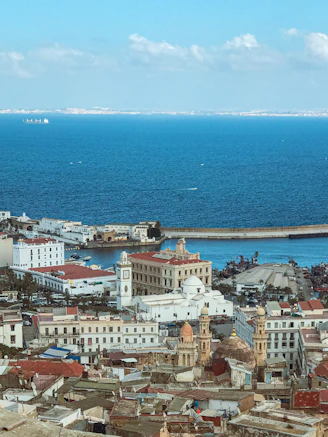a large body of water sitting next to a city