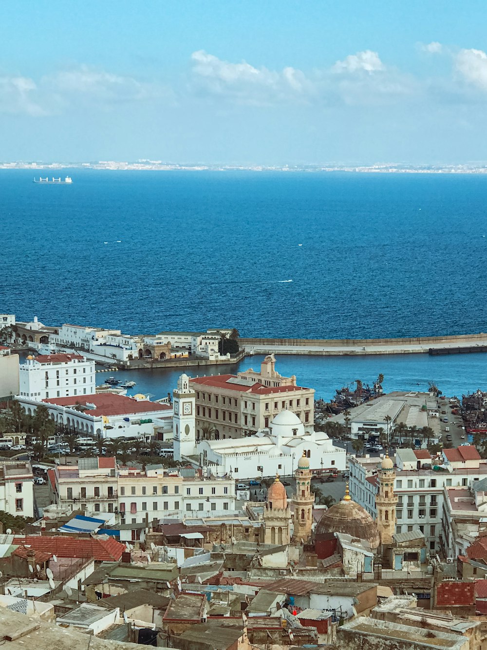 a large body of water sitting next to a city