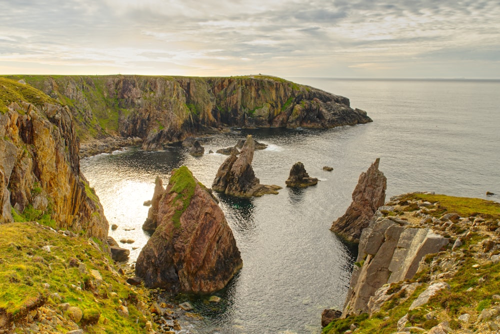 a large body of water surrounded by rocky cliffs