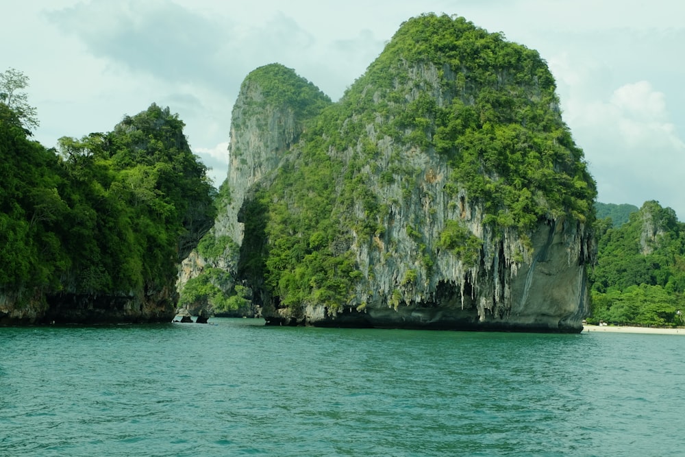 a group of rocks in the middle of a body of water