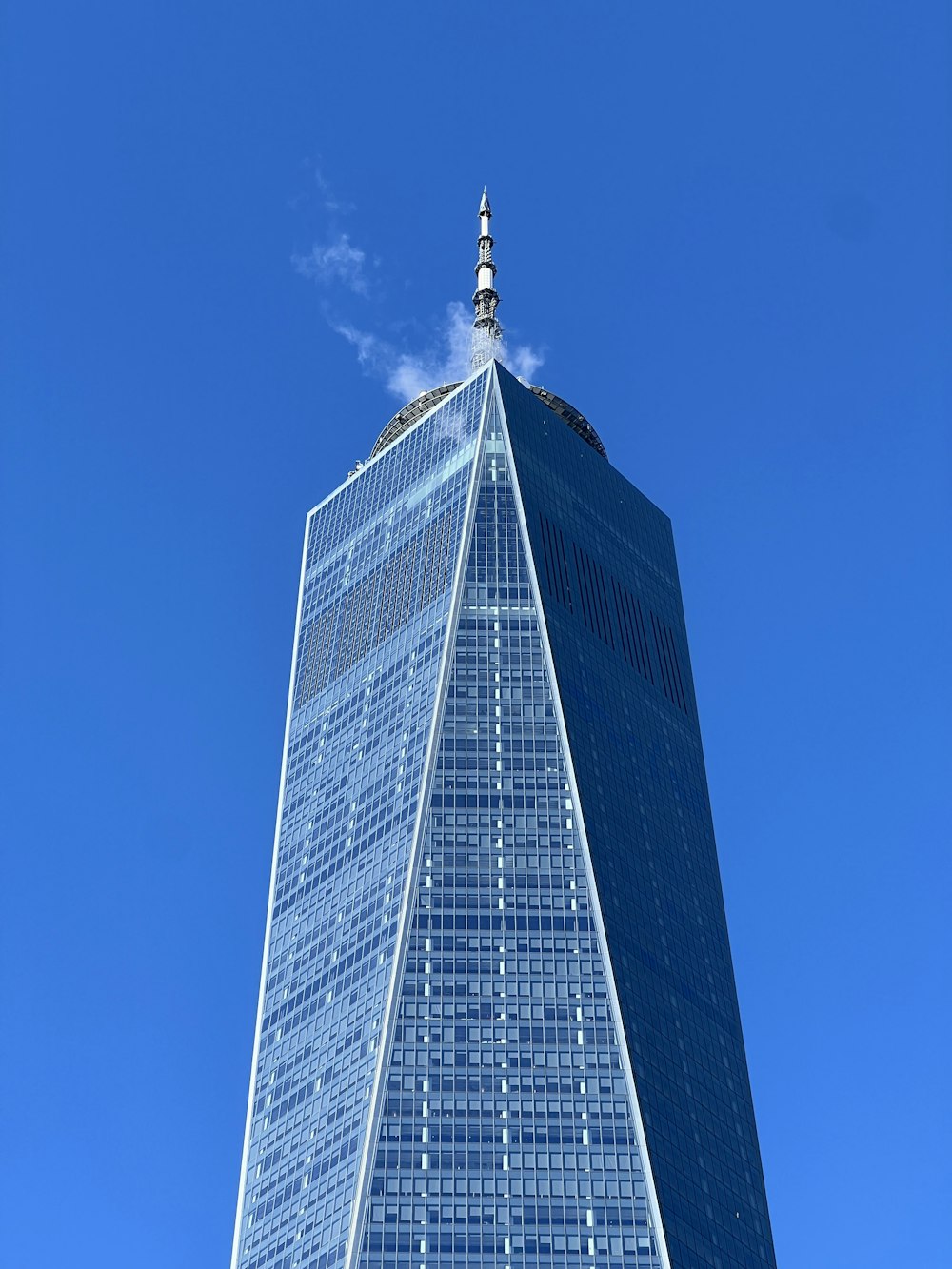 a very tall building with a sky background