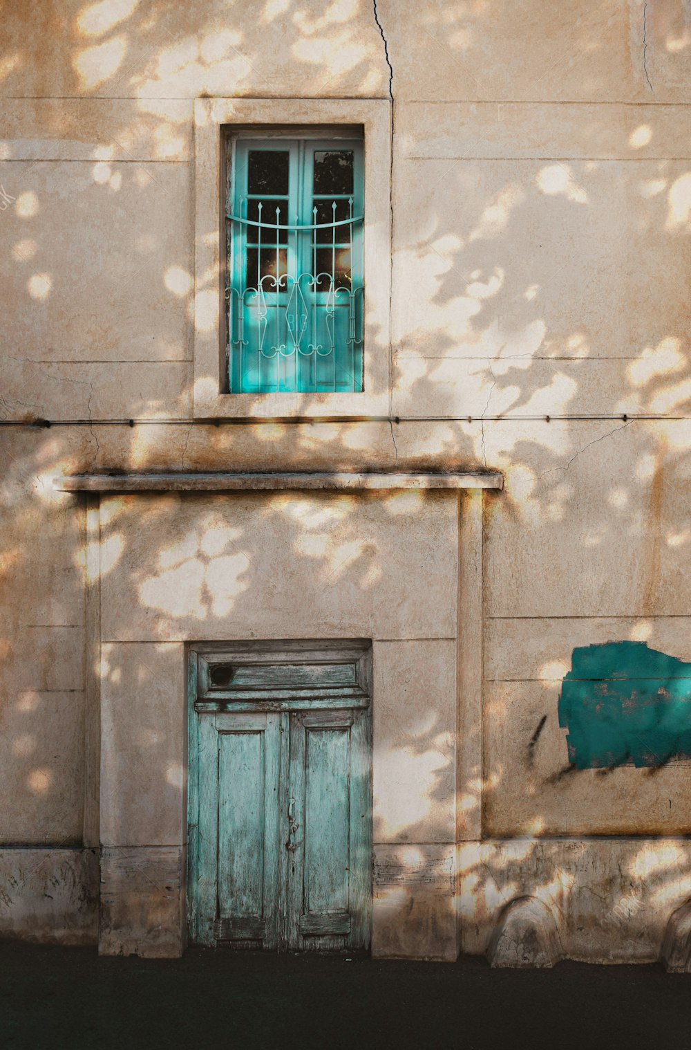 a building with a green door and window