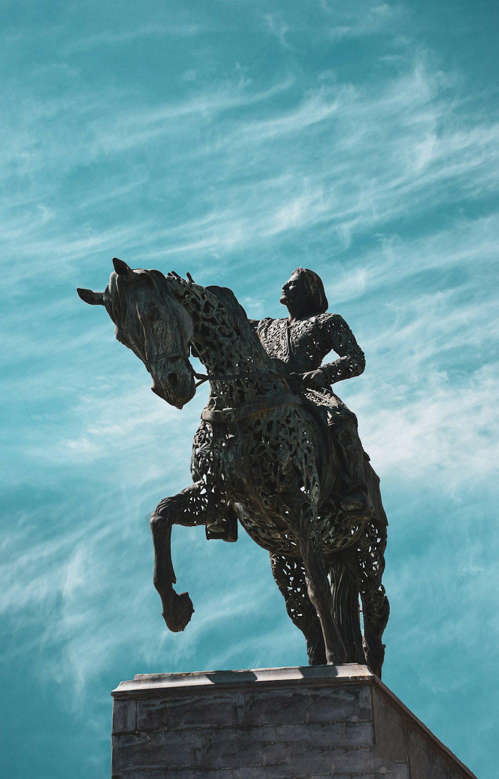 a statue of a man riding a horse