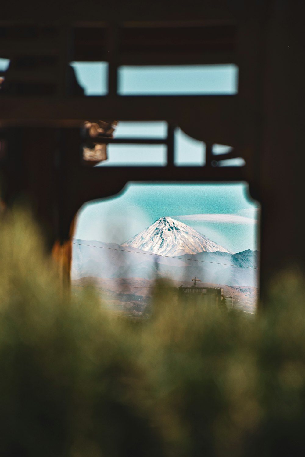 a view of a mountain through a window