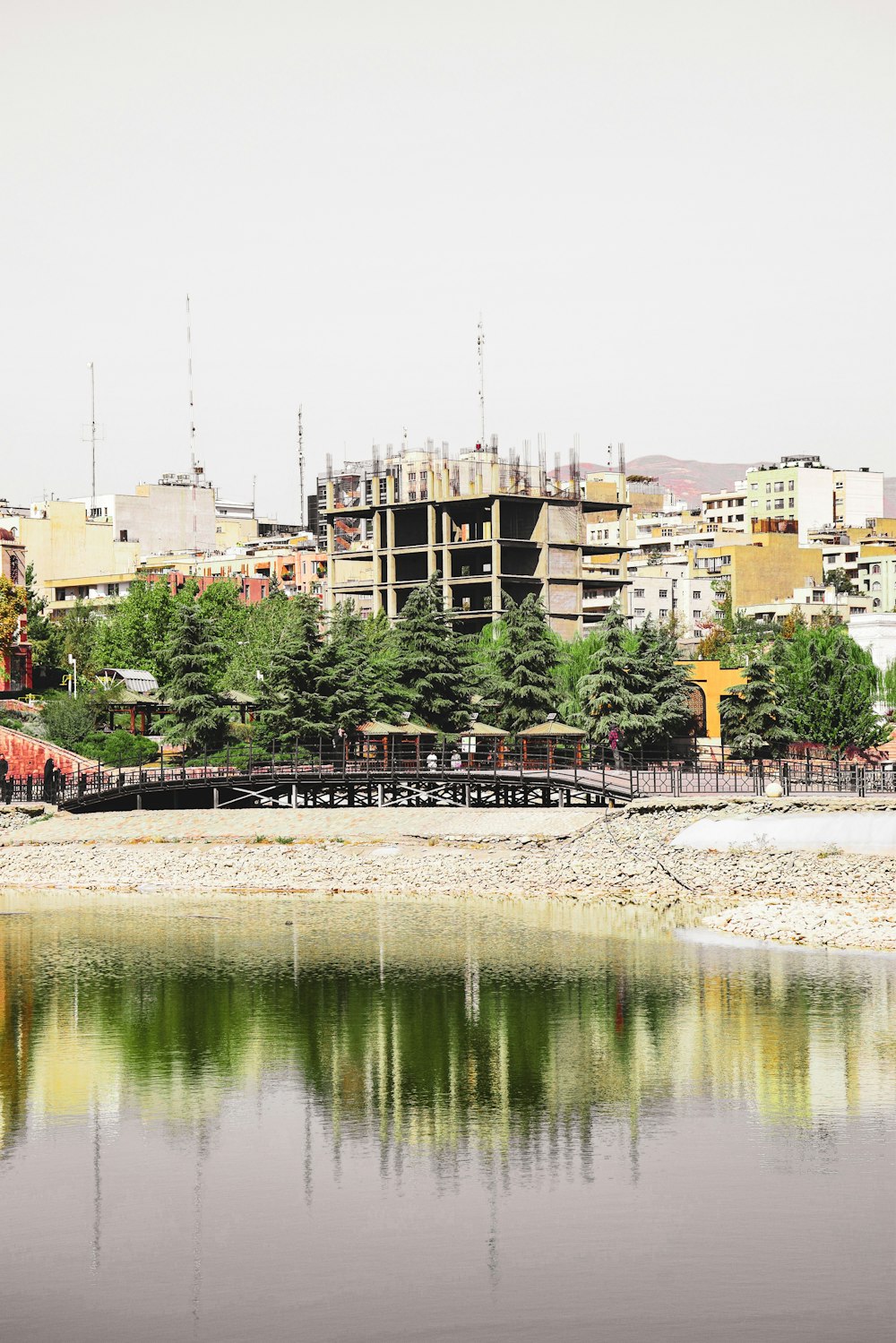 a body of water with a city in the background