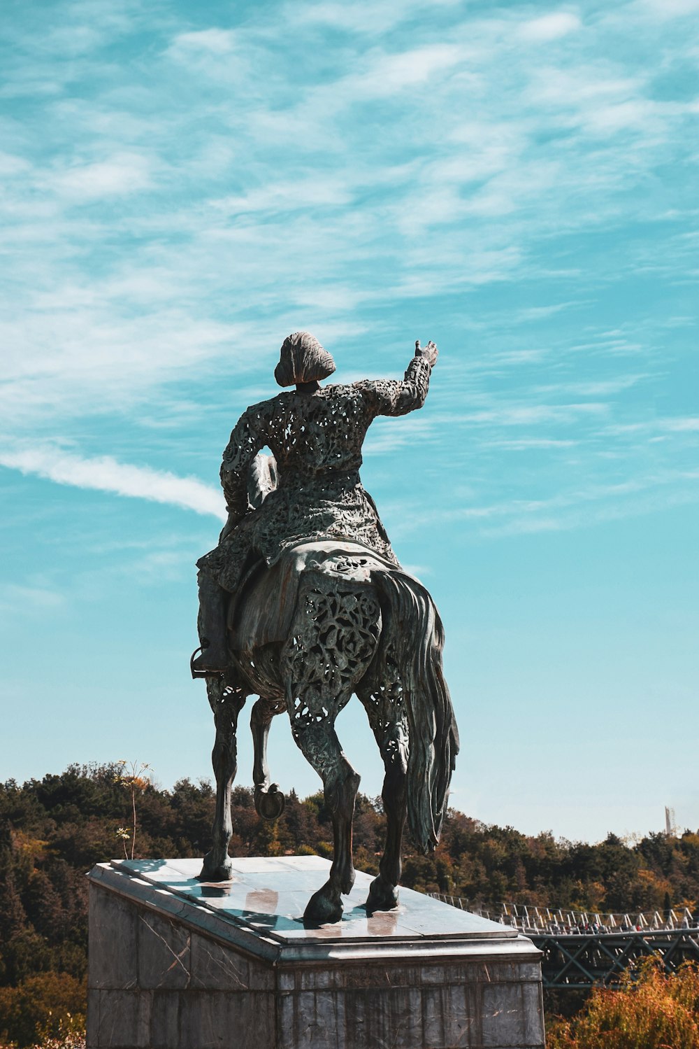 a statue of a man riding on the back of a horse