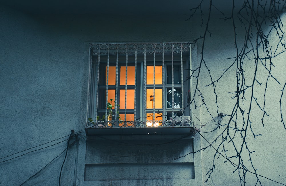 a window with bars on the outside of it