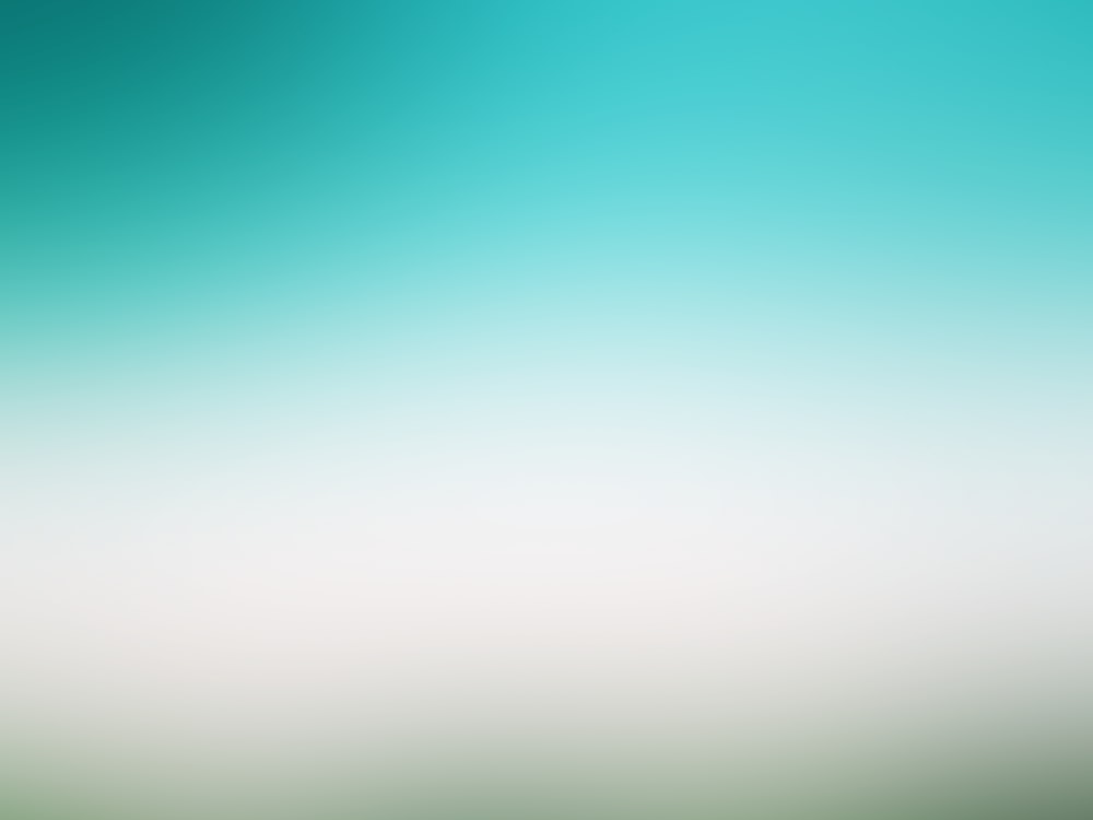 a blurry image of a green and white background