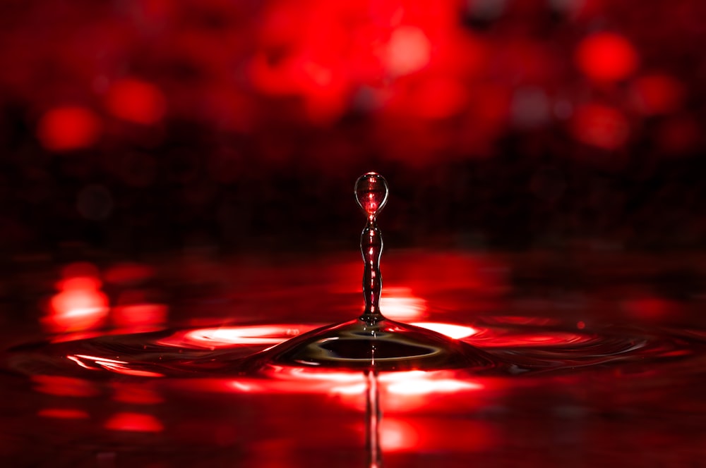 a drop of water with a red background