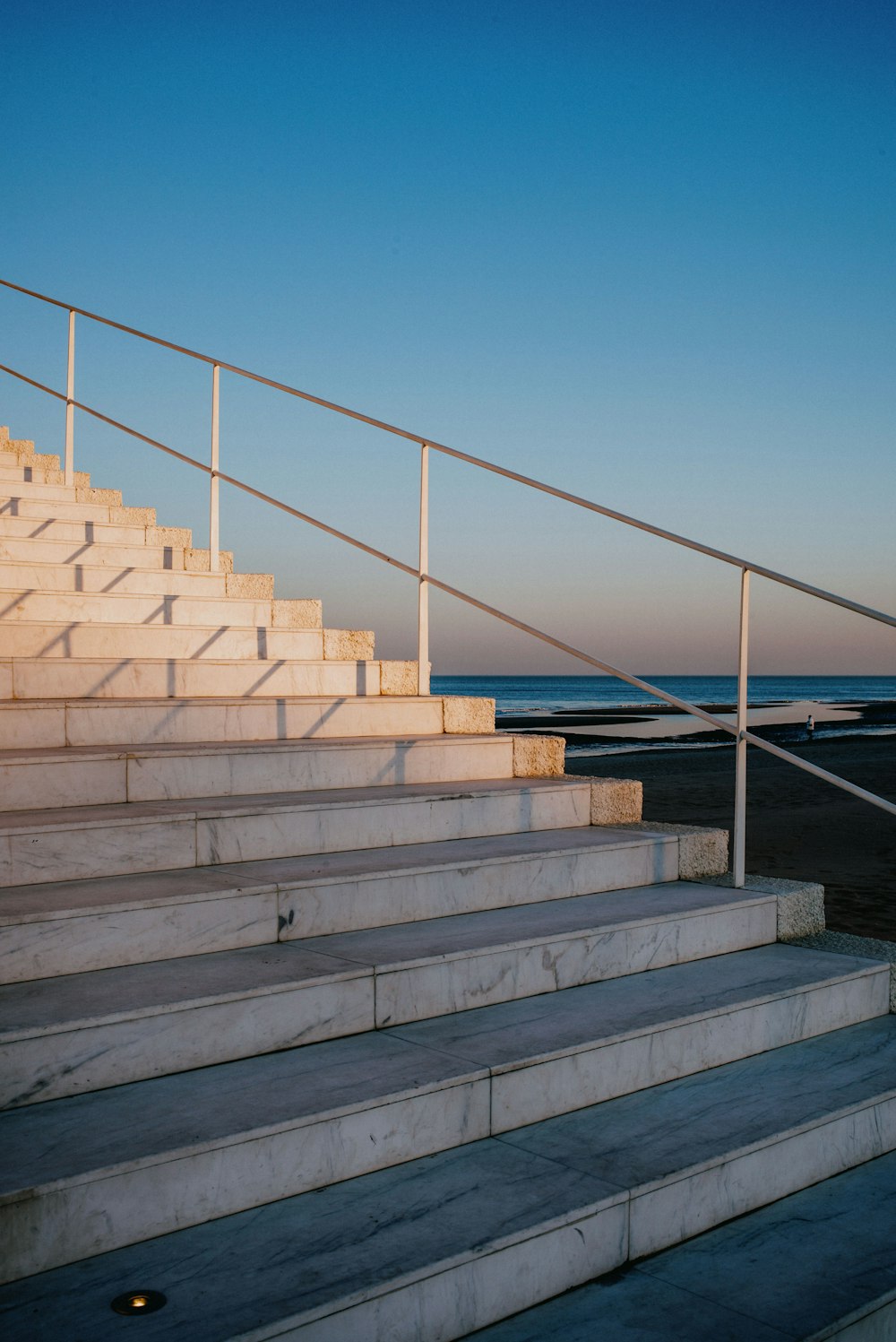 a man riding a skateboard down a set of stairs