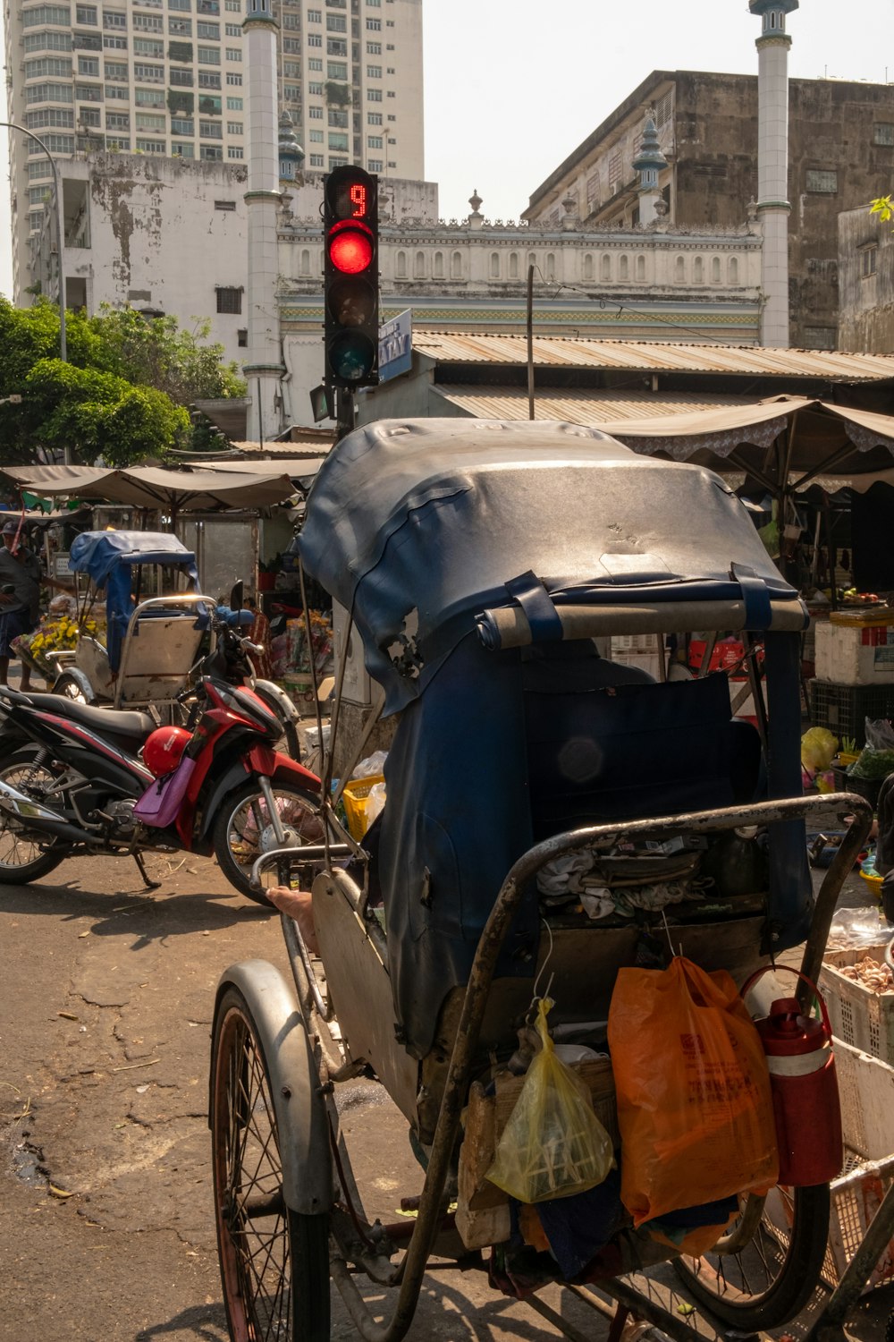 a bike with a side car attached to it on a city street