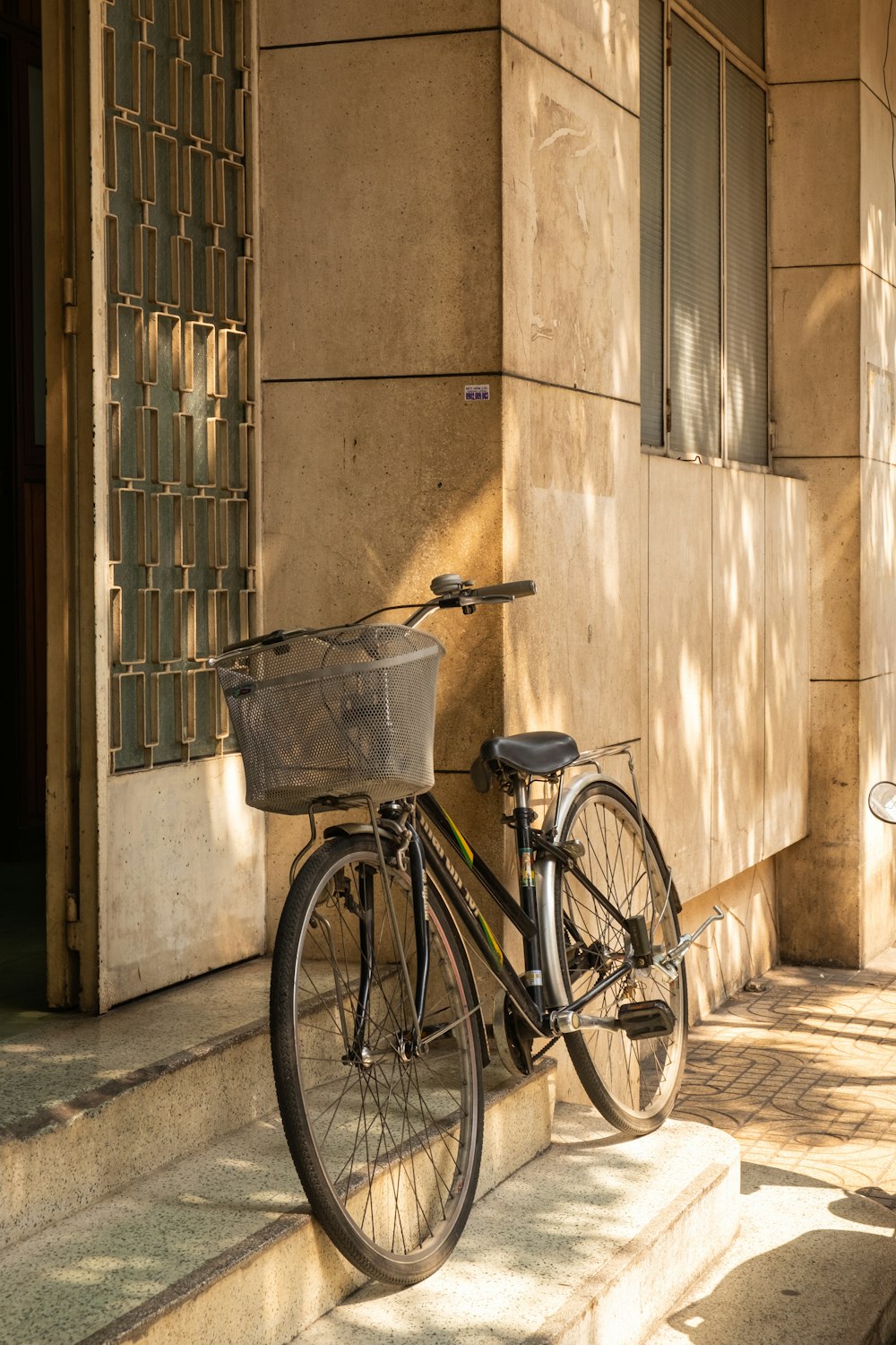 a bicycle parked on the side of a building