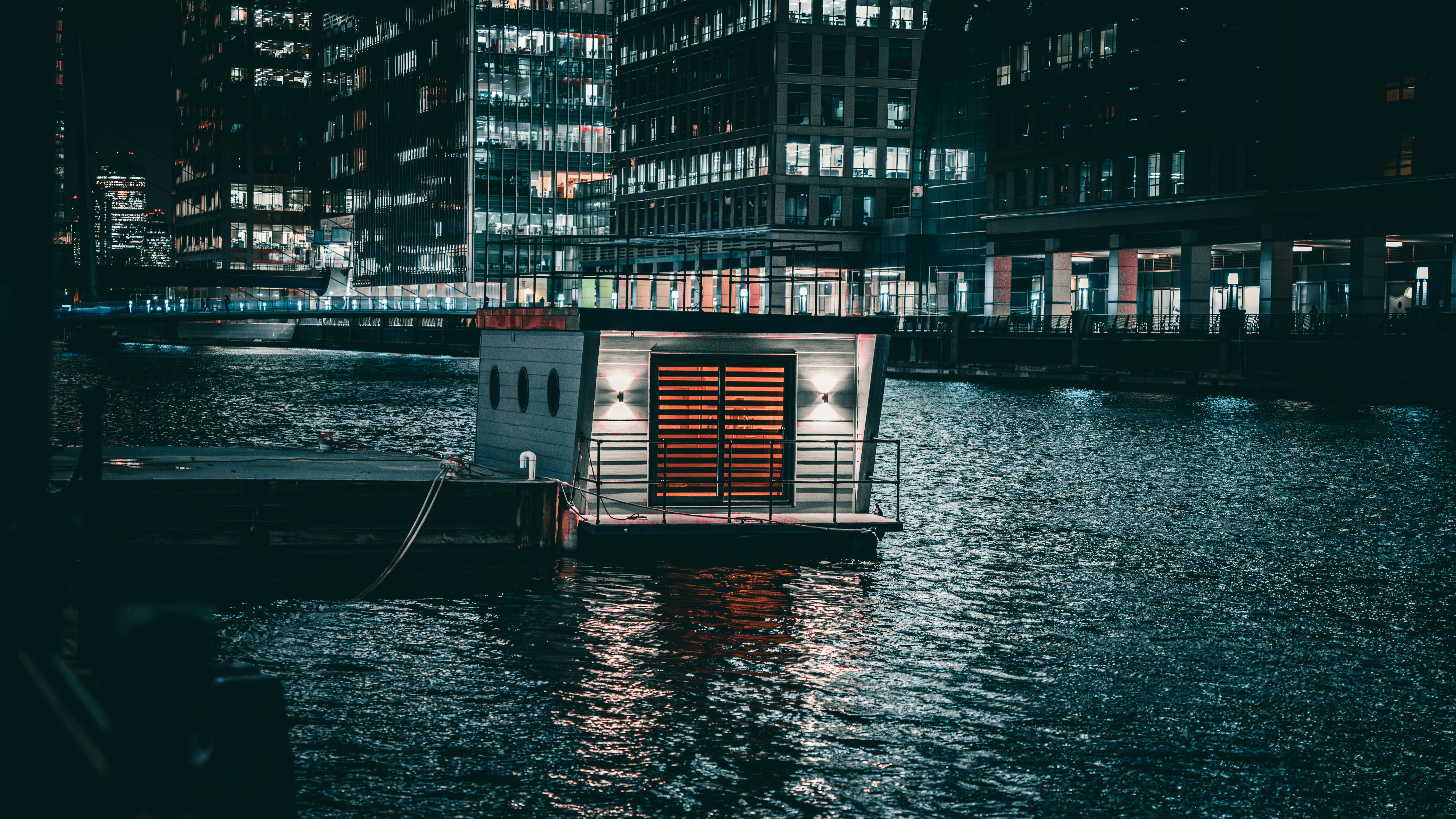 a small boat floating on top of a body of water