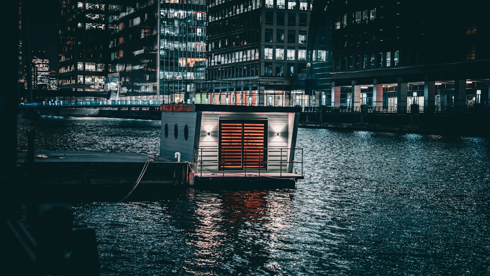 a small boat floating on top of a body of water