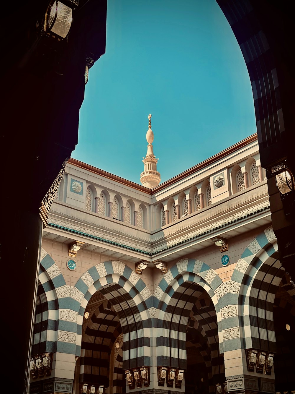 a building with arches and a clock tower