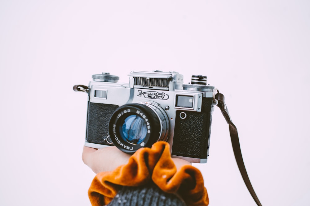 a person holding a camera up to their face