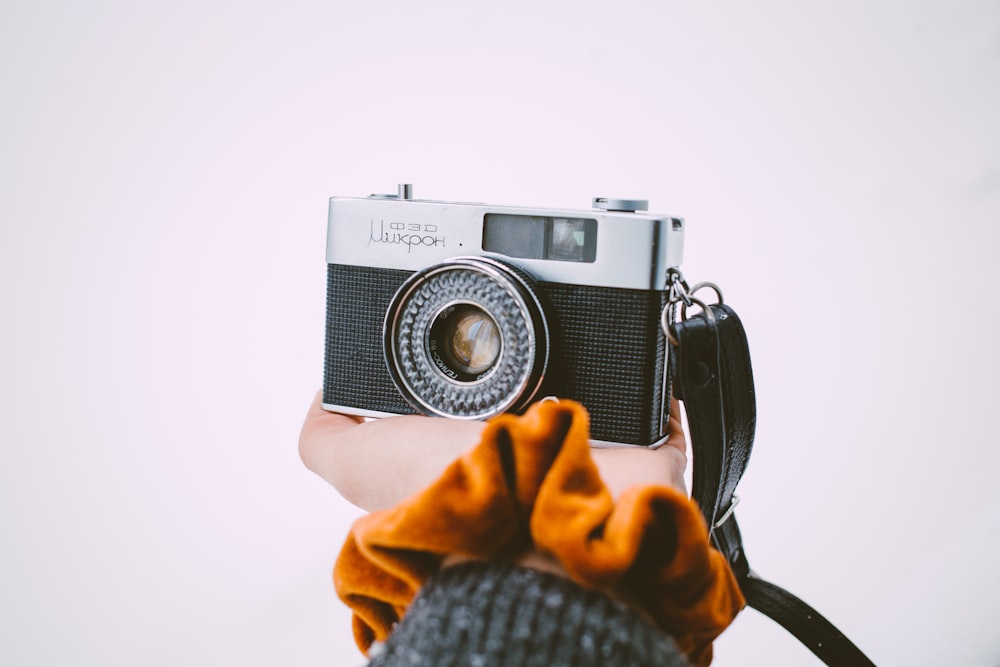 a person holding a camera up to their face