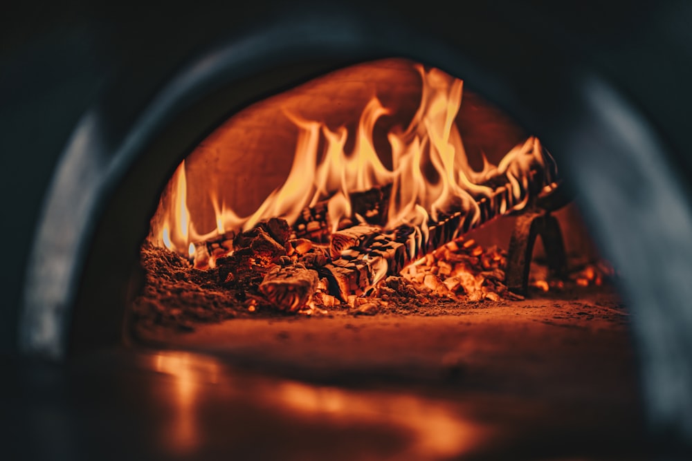 a close up of a fire burning in a brick oven