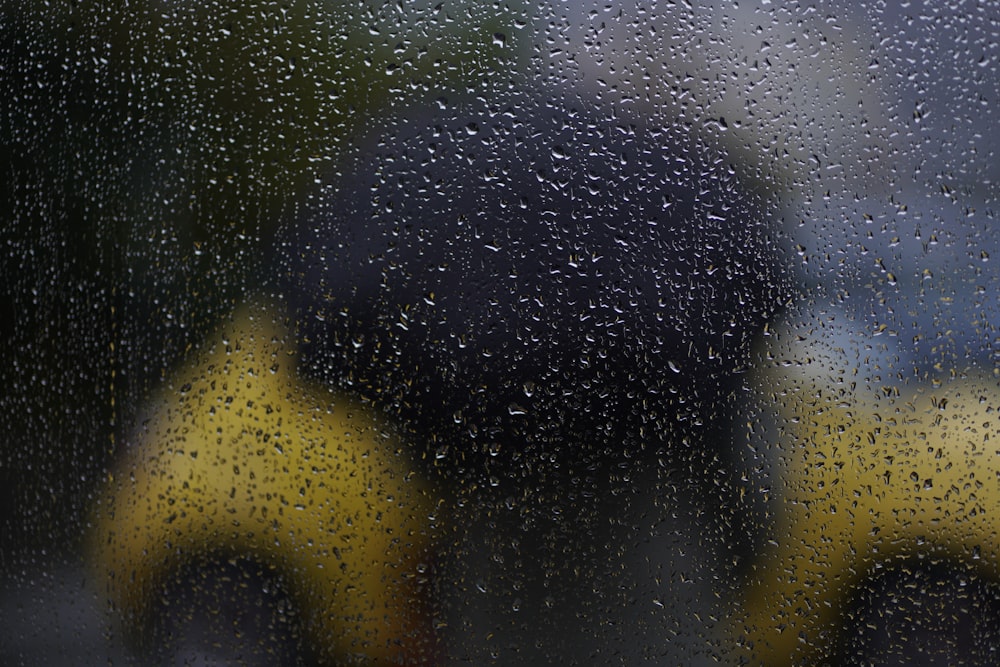 a close up of a rain covered window