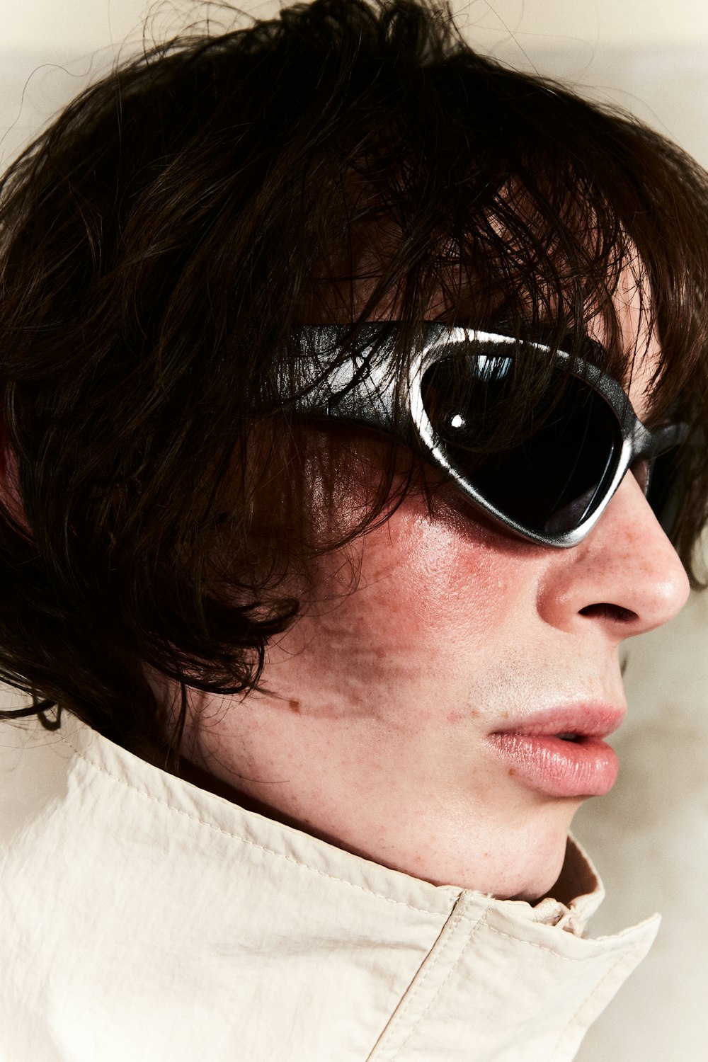 a close up of a person wearing sunglasses