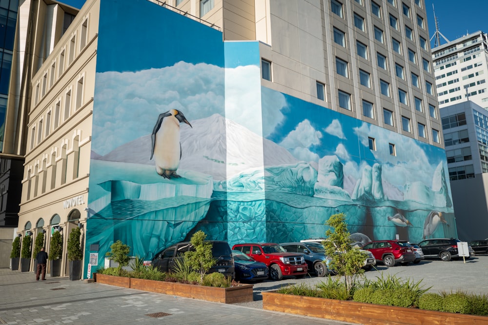 a large mural of a penguin on the side of a building