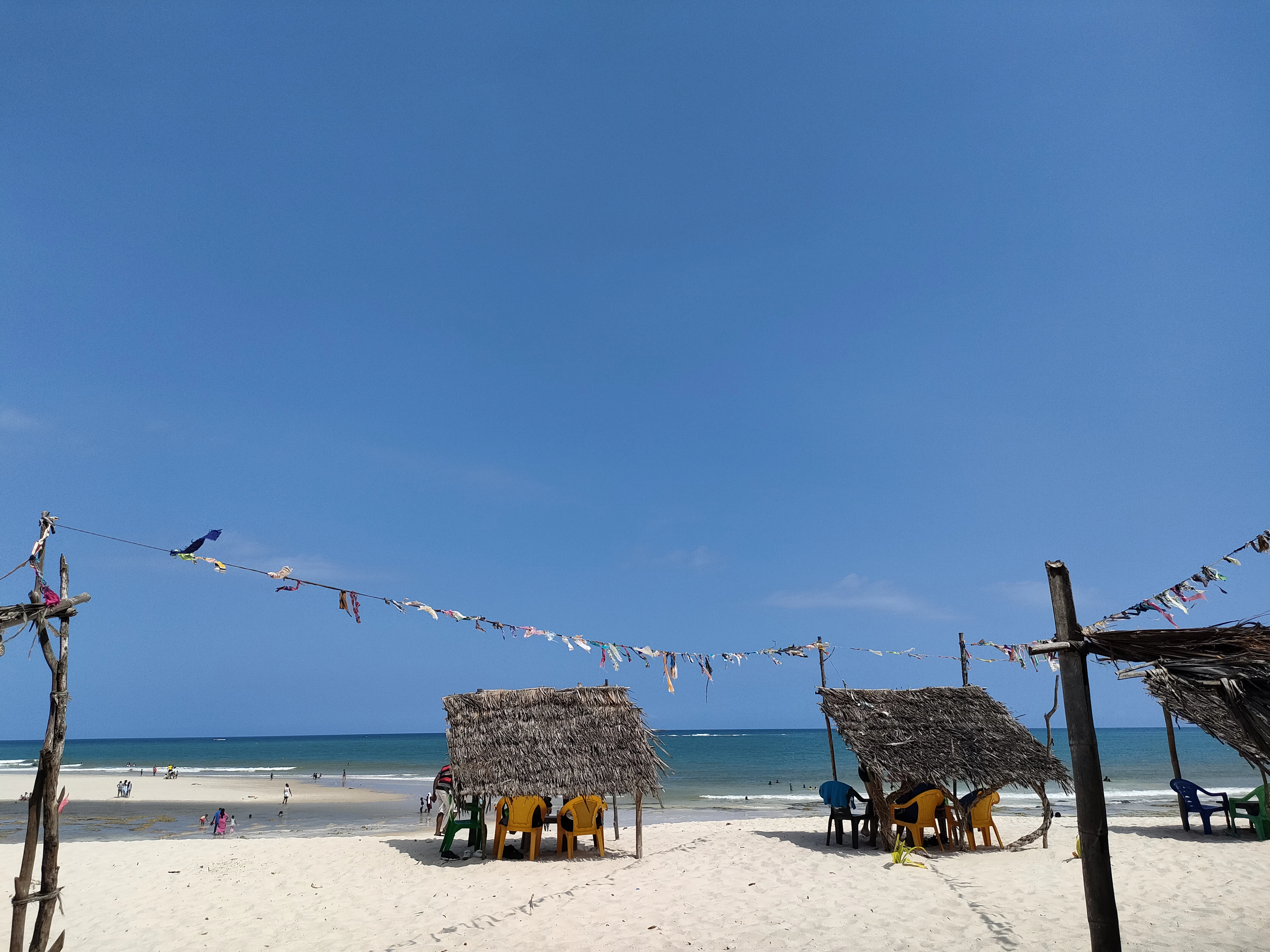 Diani Beach loungers and thatched huts on powder-white sand