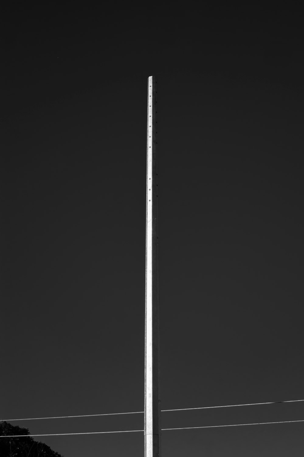 a black and white photo of a street light