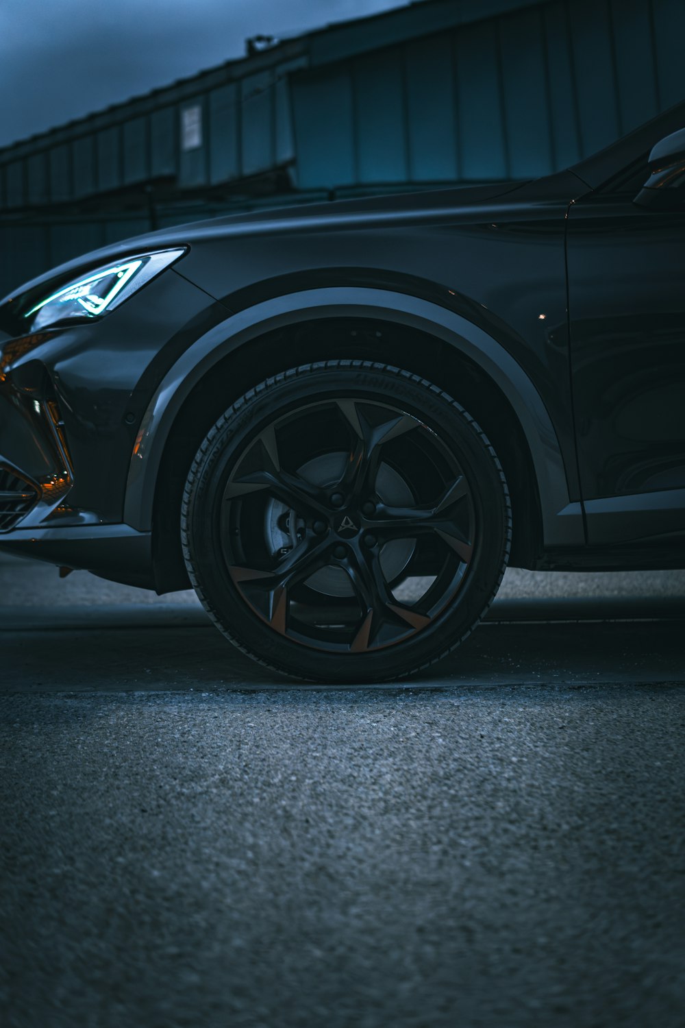 a car parked in a parking lot at night