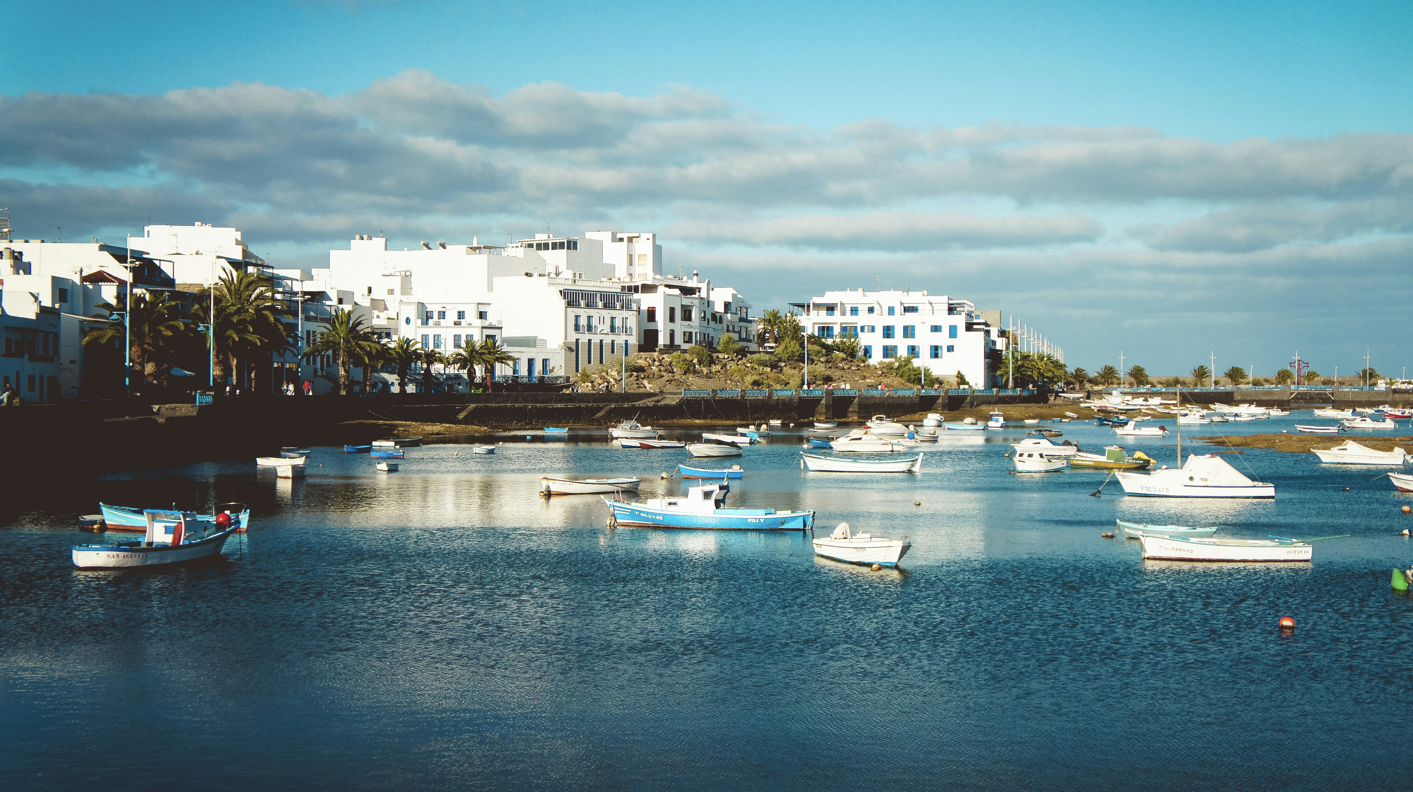 a group of boats floating on top of a body of water