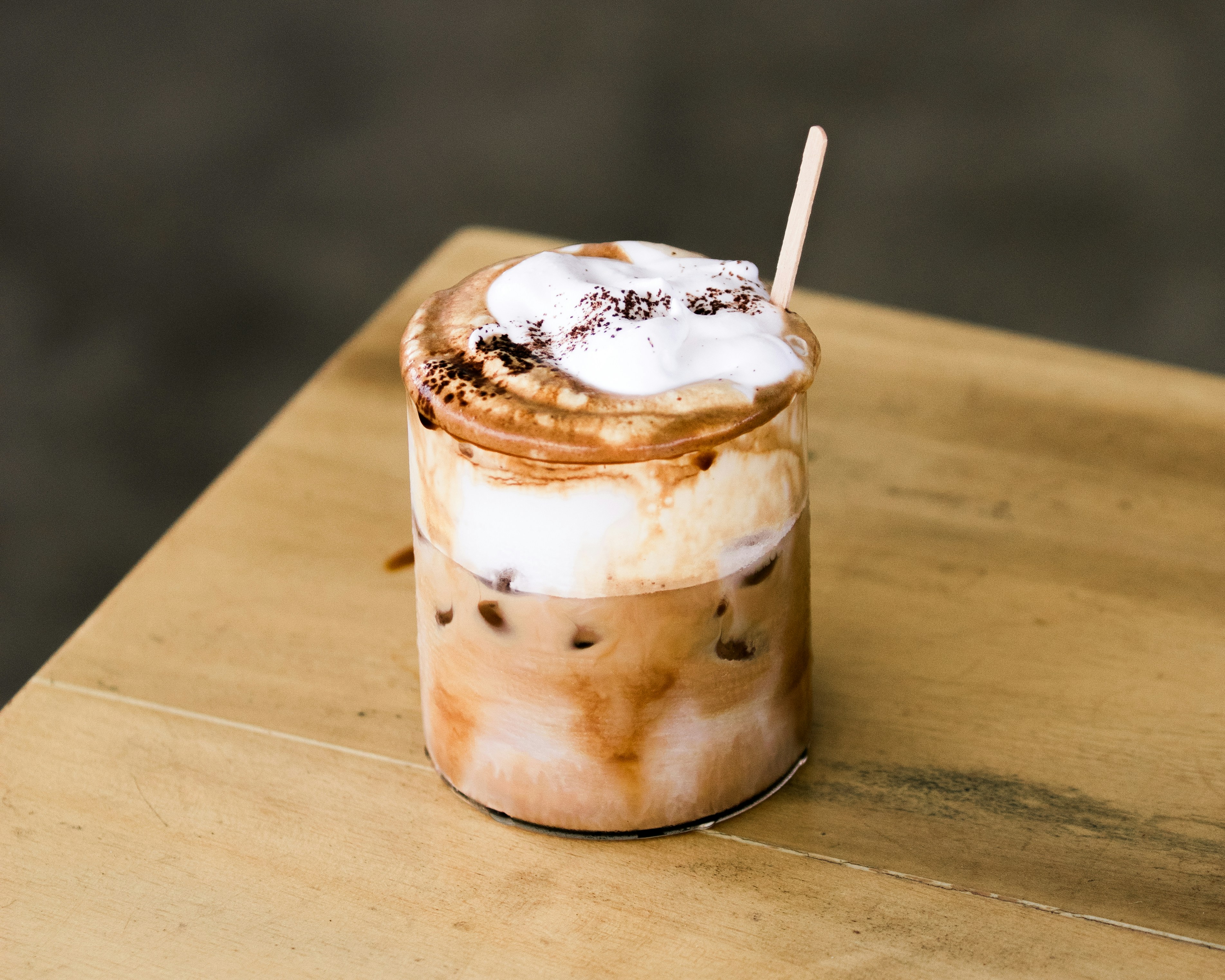 a cup of coffee with whipped cream and chocolate