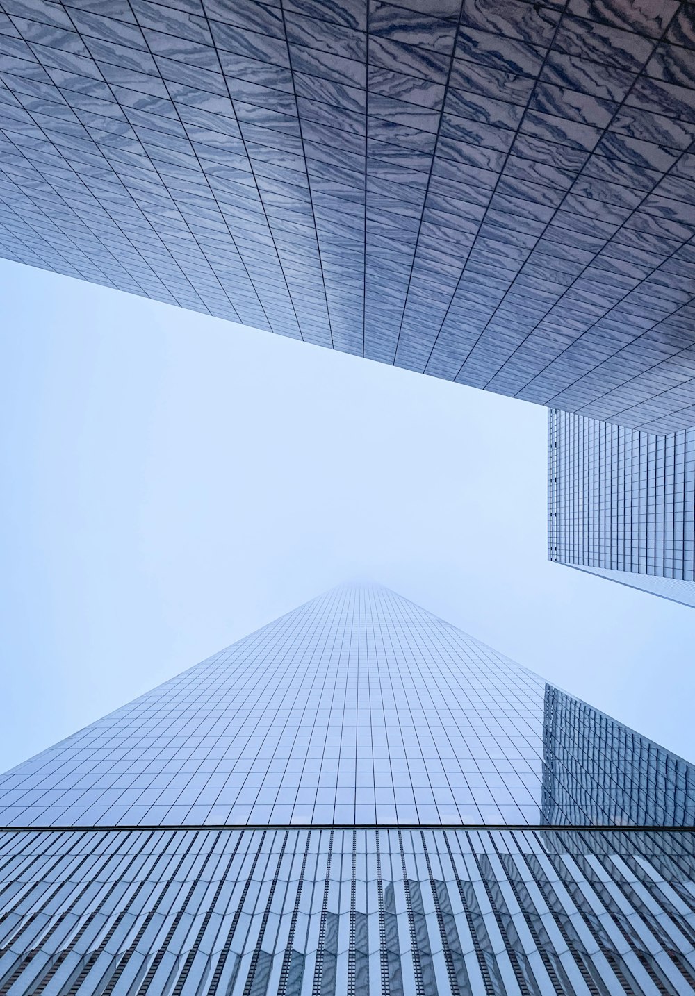 a very tall building towering over a city