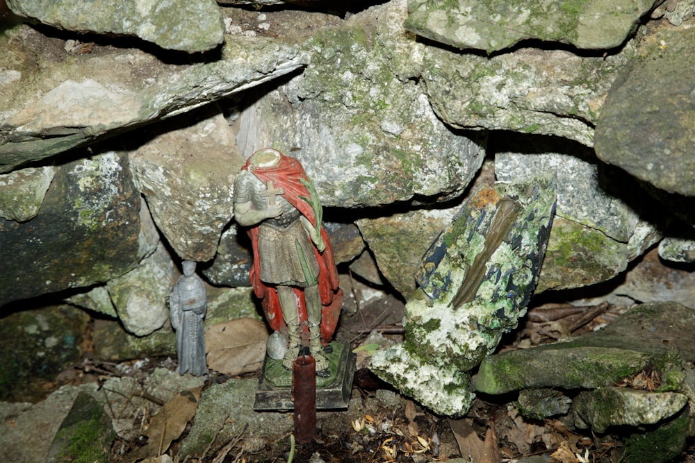 a statue of a man in a stone cave