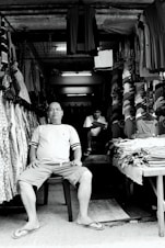 a man sitting on a chair in a store
