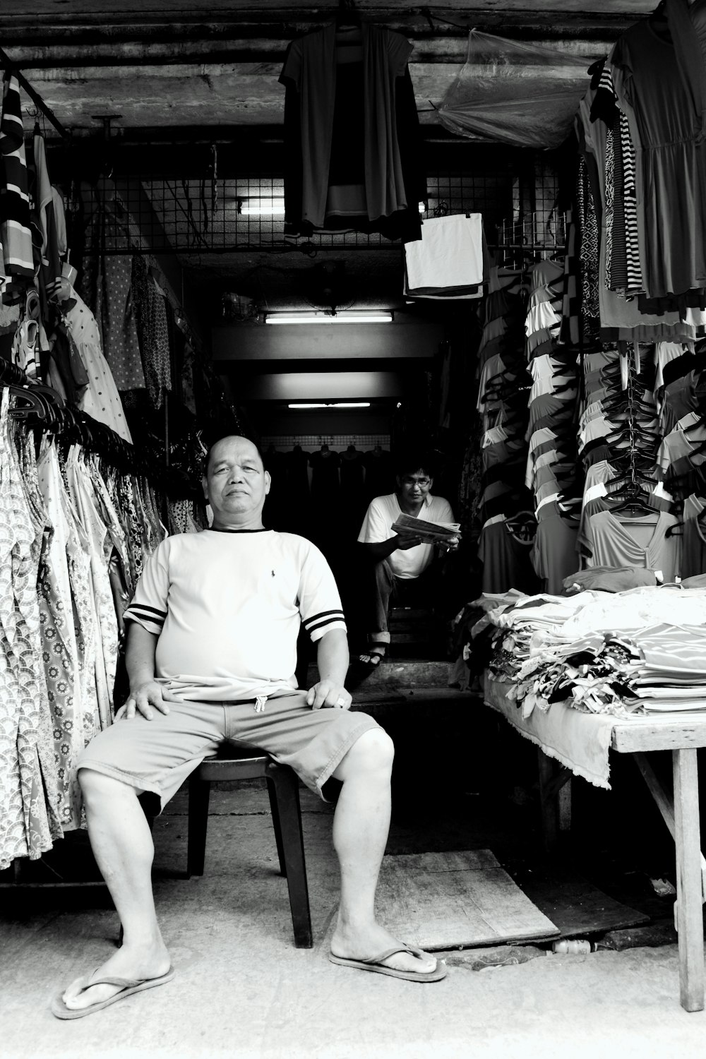 a man sitting on a chair in a store