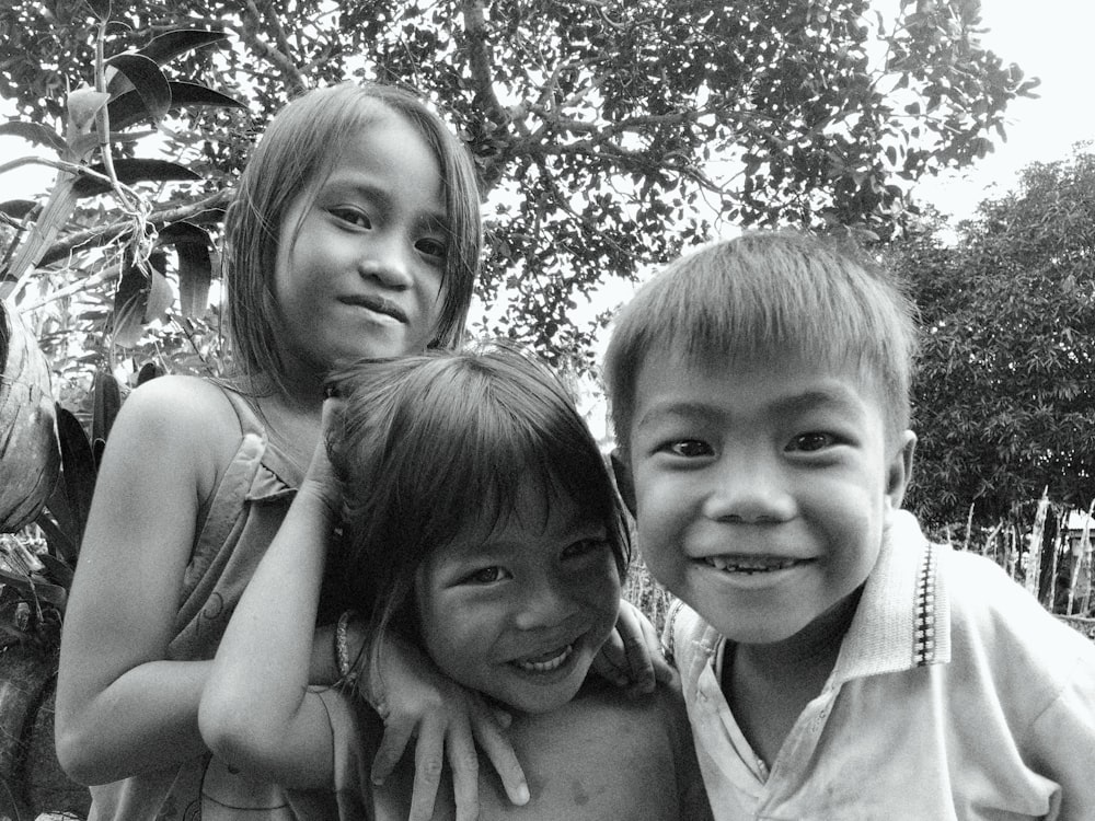 a group of young children standing next to each other