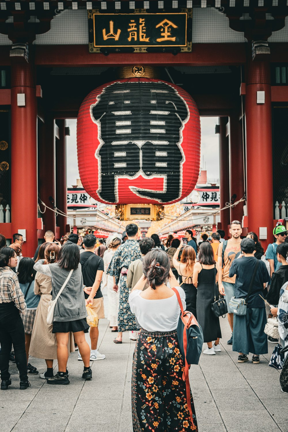 a group of people standing in front of a building