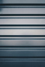 a close up of a metal surface with horizontal lines