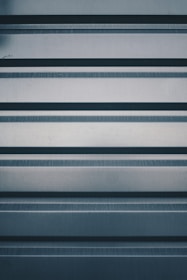 a close up of a metal surface with horizontal lines