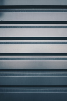 a close up of a metal surface with horizontal lines
